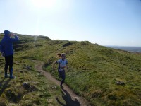 Fiona storming across the hill in the relay